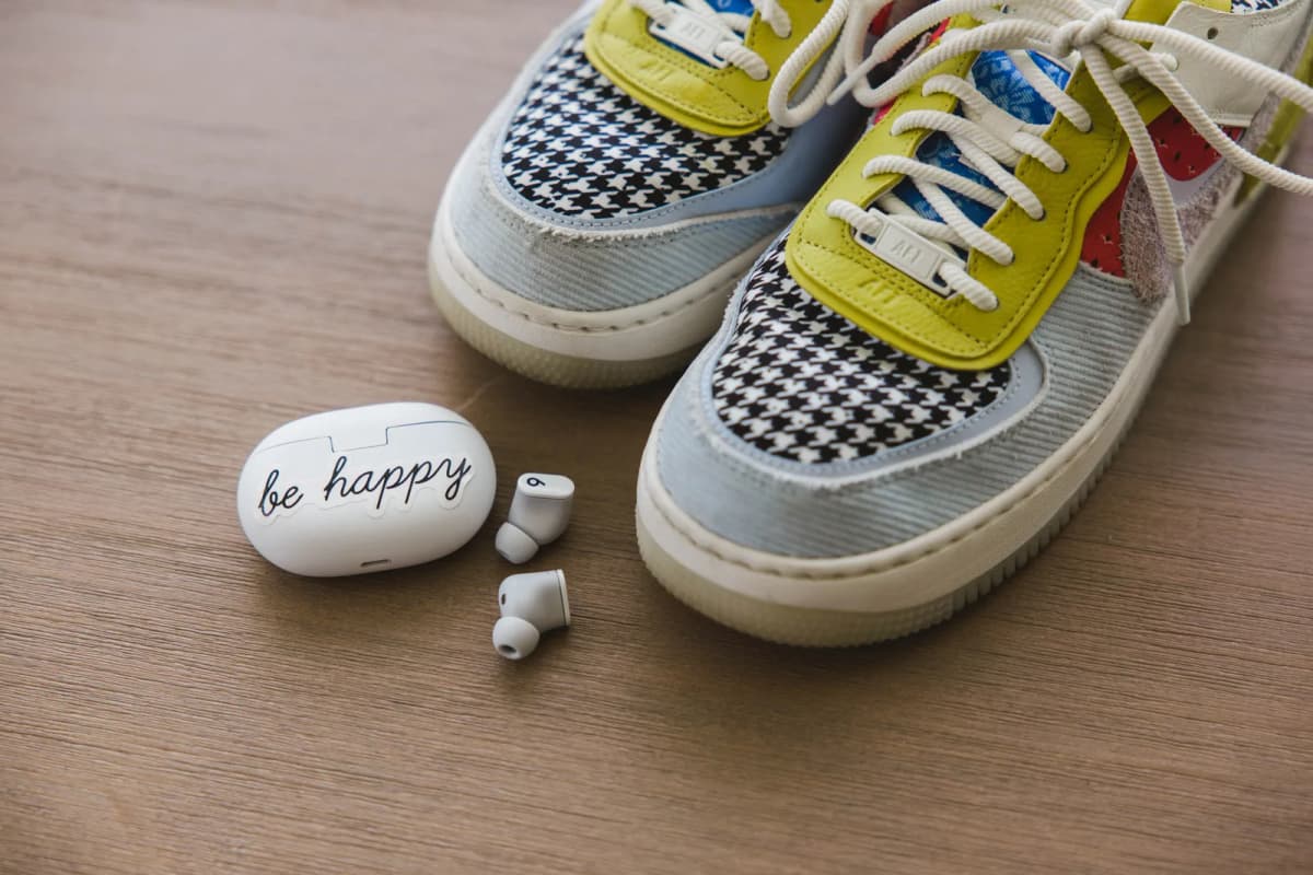 Walking shoes and wireless earbuds, ready for a power walk session